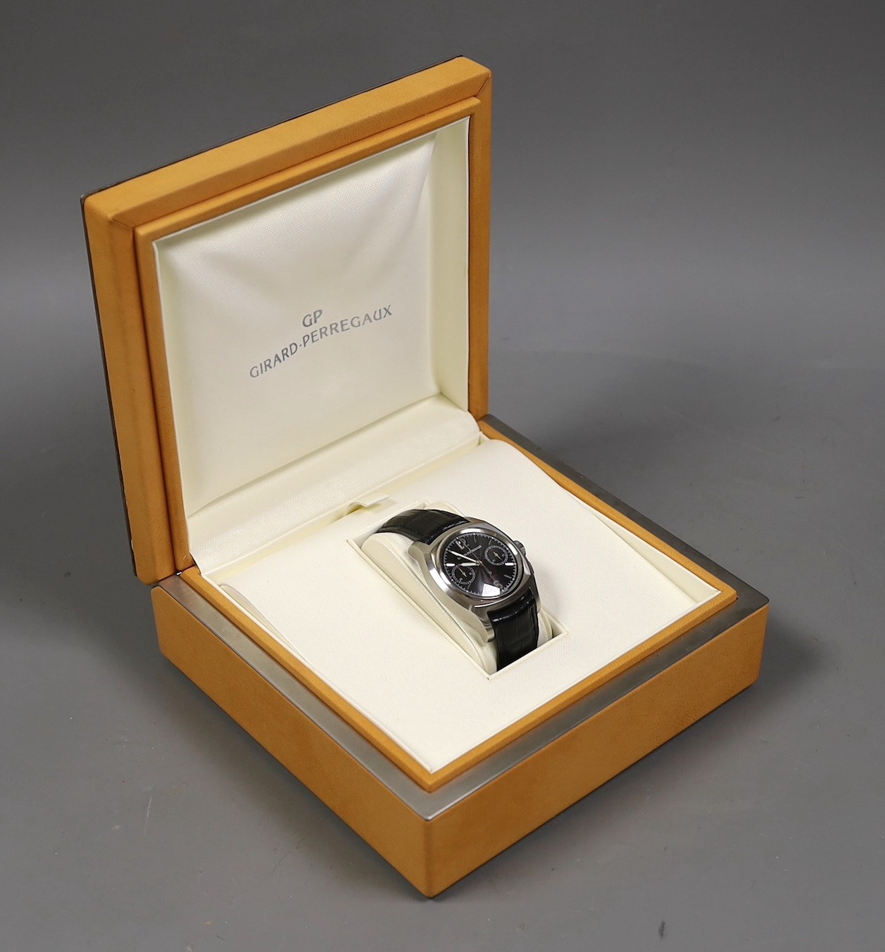 A gentleman's early 2000's stainless steel Girard Perregaux automatic chronograph wrist watch, model no. 2499, the case back engraved AN.79, with box and booklet, case diameter 39mm, on Girard Perregaux leather strap wit